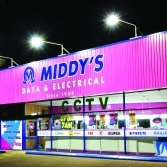 Building signage - Middy's store at night